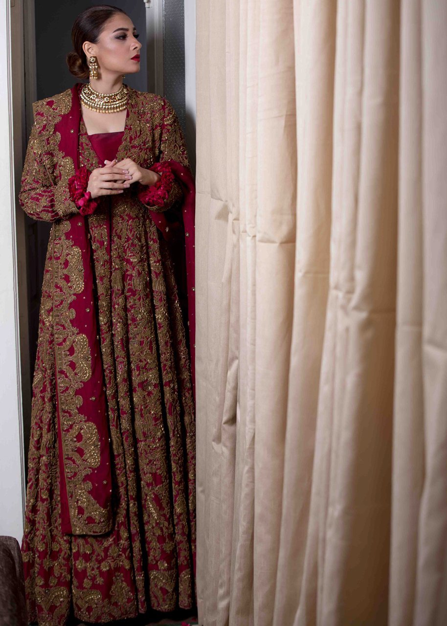 Pakistani Bridal Gown In Red Color With Dull Gold Embroidered Work